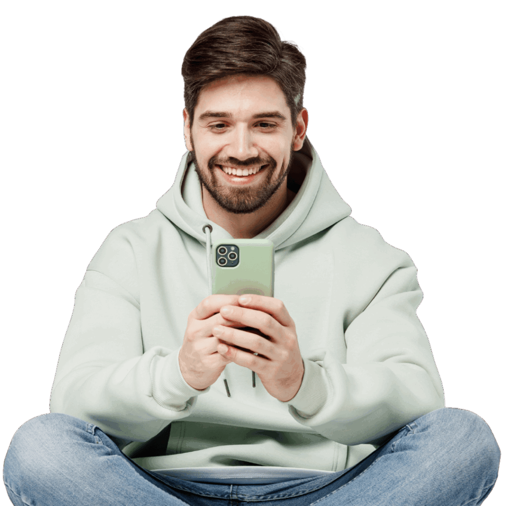adult man happily browsing on his mobile device